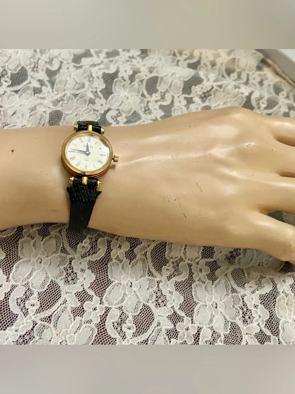 Gucci, Swiss Made, Quartz Gold Tone Ladies Watch with Burgundy Glass Backing